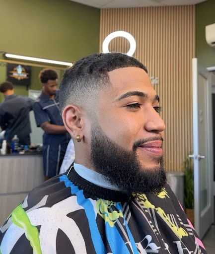 High skin fade · sharp line-up · full beard