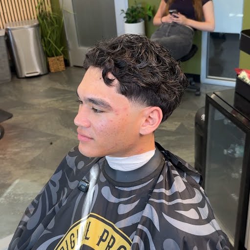 Textured curls with low taper fade