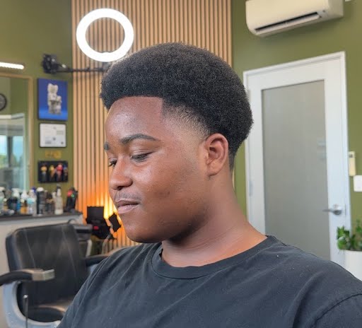 High volume afro · clean low fade